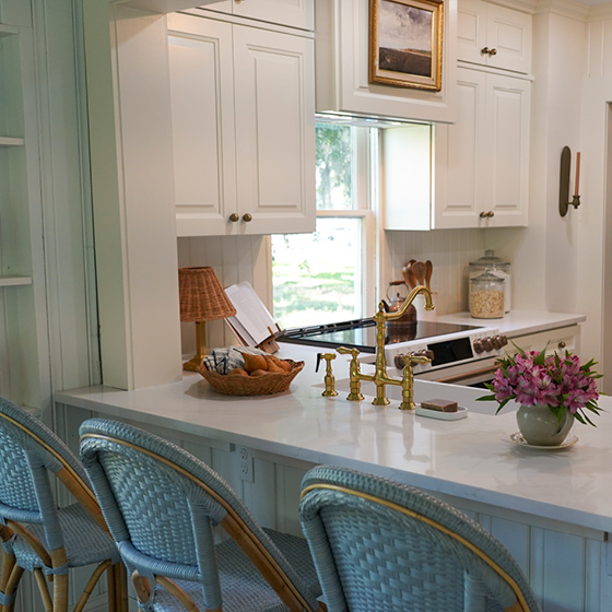 Six-image carousel of living room, child’s room, entryway, backyard and kitchen, all incorporating Renew Blue.