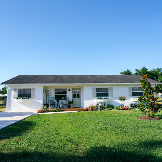 Six-image carousel of living room, child’s room, entryway, backyard and kitchen, all incorporating Renew Blue.